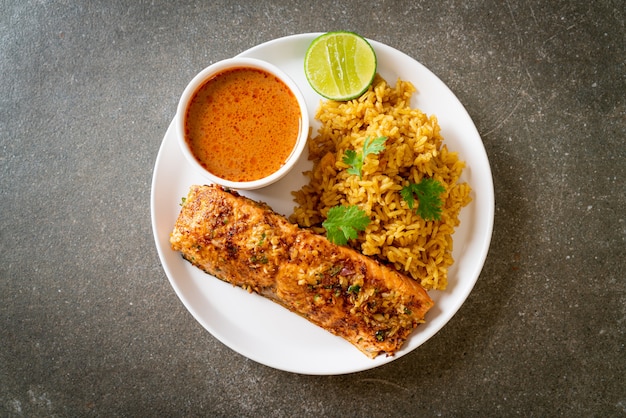 pan seared salmon tandoori with masala rice. muslim food style