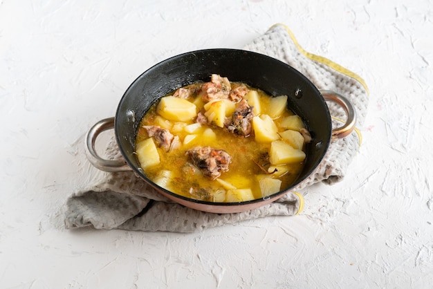 Pan with cooked potato fried meat balls with herbs and spices