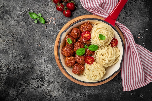 Pan with italian pasta with tomato sauce and meatballs\
restaurant menu dieting cookbook recipe top view