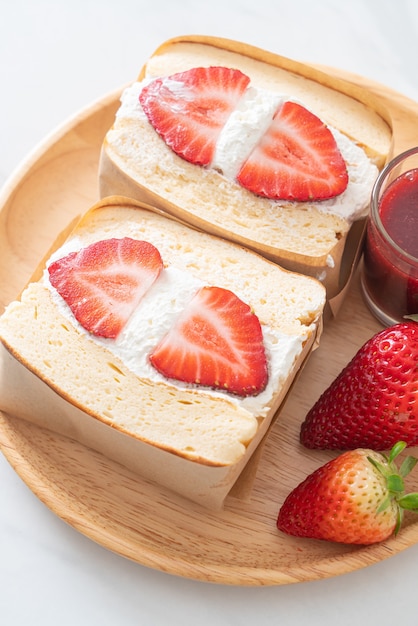 pancake sandwich strawberry fresh cream on wood plate