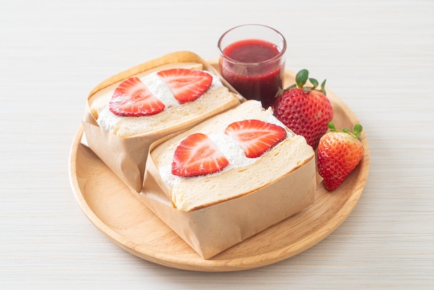 pancake sandwich strawberry fresh cream on wood plate