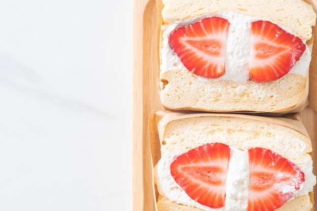 pancake sandwich strawberry fresh cream on wood plate