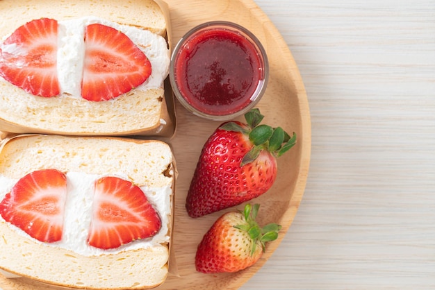 Pancake sandwich strawberry fresh cream on wood plate