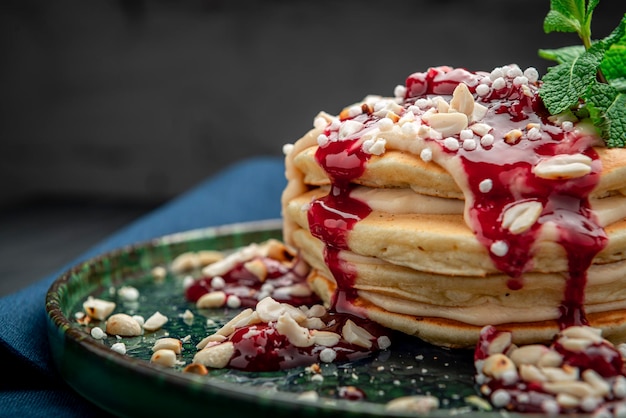 Pancake tower with yogurt nuts and cherry jam