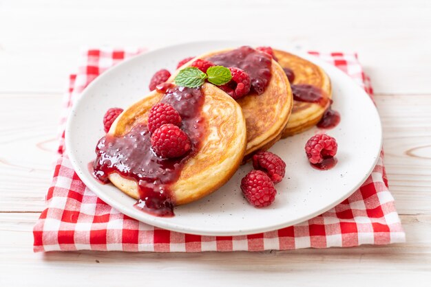 pancake with fresh raspberries and raspberry sauce