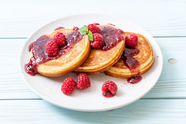 pancake with fresh raspberries and raspberry sauce