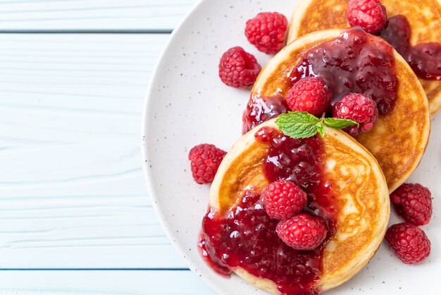 pancake with fresh raspberries and raspberry sauce