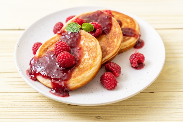 pancake with fresh raspberries and raspberry sauce