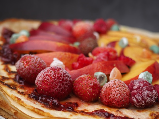 A pancake with fruit on it