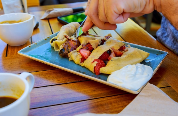 Pancake with fruits and cream