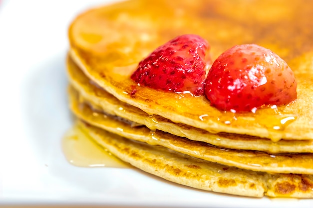 Pancake with strawberries and honey very delicious