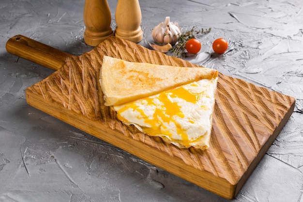 Pancake with yolk of egg and cheese  crepes dish french cuisine