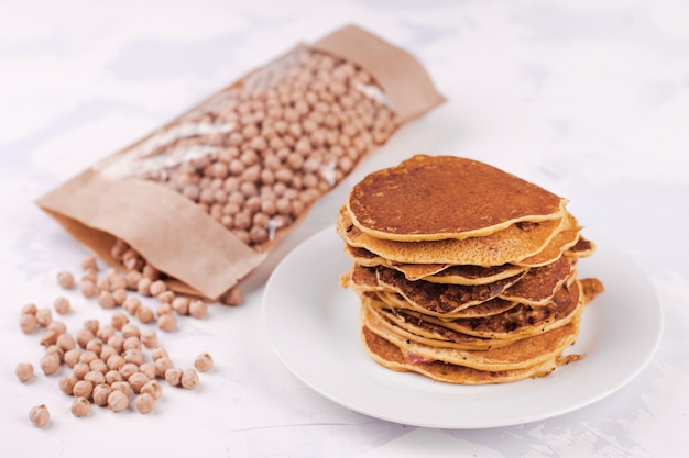 Pancakes or fritters of chickpeas flour, vegetarian snack