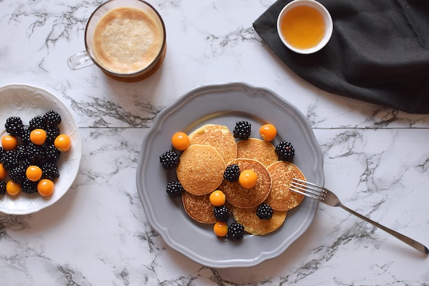 Pancakes Healthy breakfast  Gluten free blackberry physalis Honey Cappuccino coffee marble  Top view Flat lay