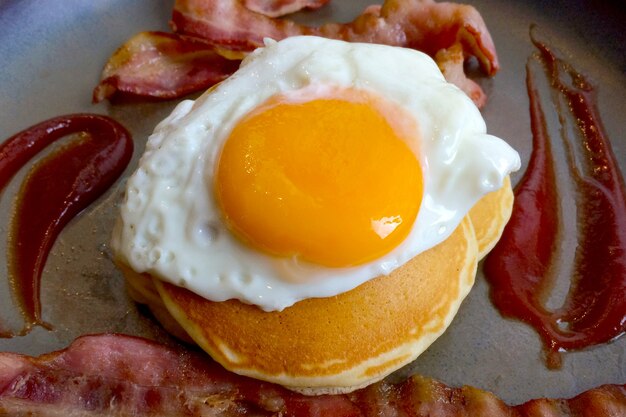 Pancakes with bacon and egg. Tasty breakfast