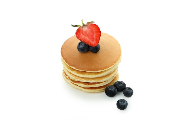 Pancakes with berries isolated on white background