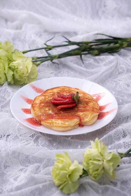 Pancakes with berries and maple syrup