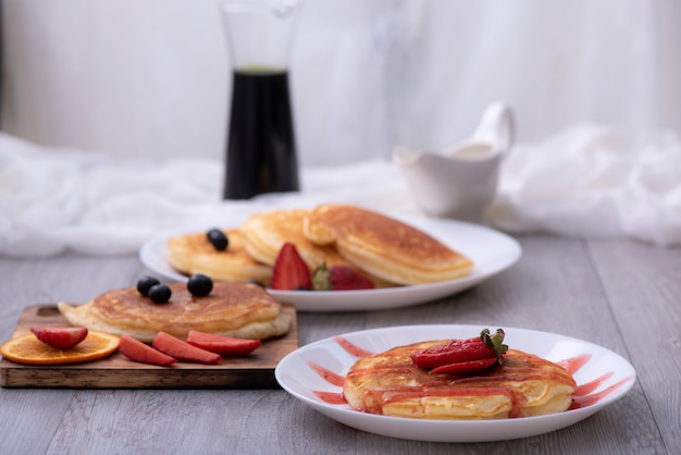 Pancakes with berries and maple syrup