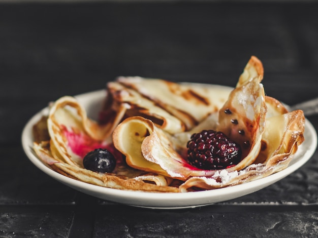 Photo pancakes with berries