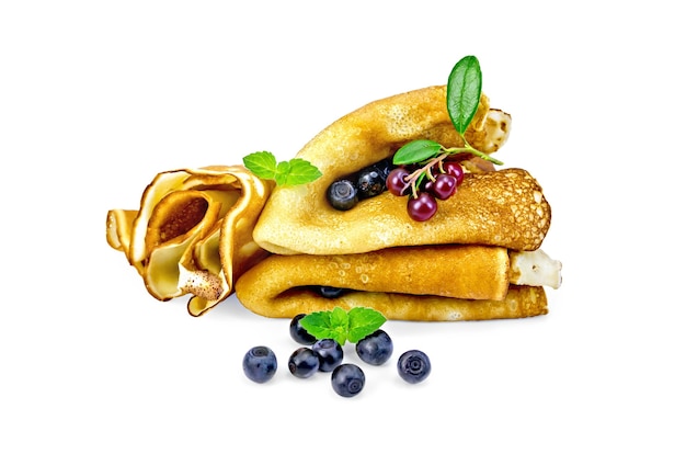 Photo pancakes with blueberries and cowberry, mint isolated