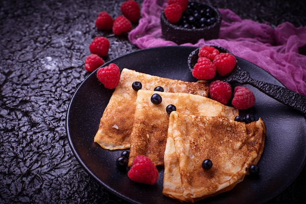 Pancakes with blueberries and raspberries