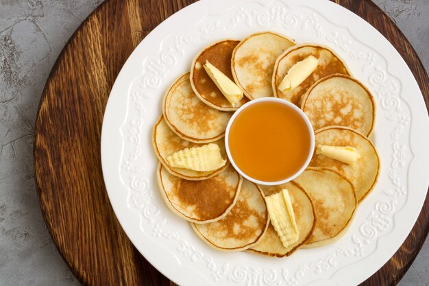 Pancakes with butter and honey.