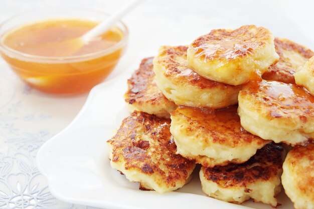 Pancakes with the cottage cheese are fried in deep-fry