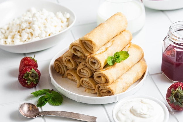 Pancakes with cottage cheese on a white background.