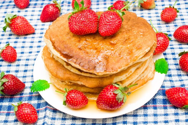 Pancakes with fresh berries and honey