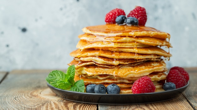 Pancakes, with fresh berries and honey