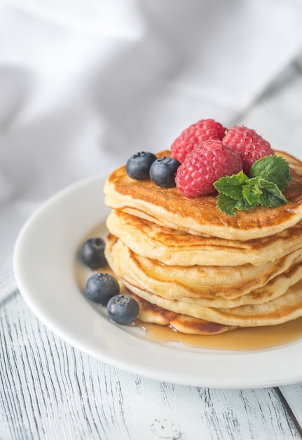 Pancakes with fresh berries on the plate