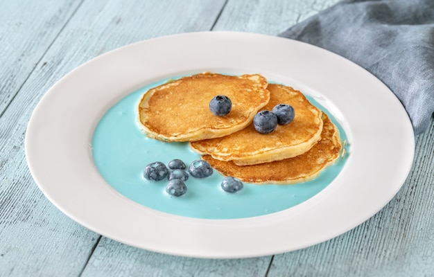 Pancakes with fresh blueberries and cream sauce