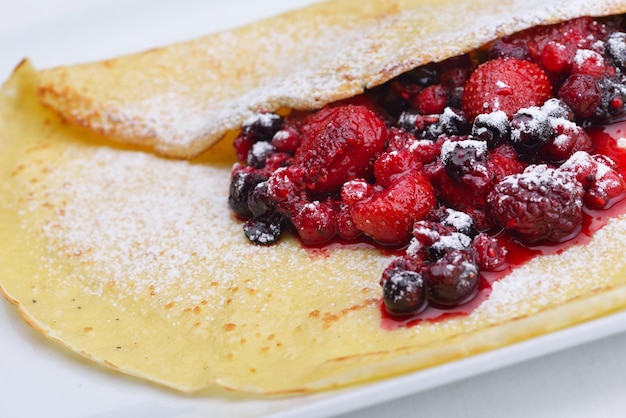 Photo pancakes with fresh strawberry jam closeup  isolated on whize background healthy organic food breakfast