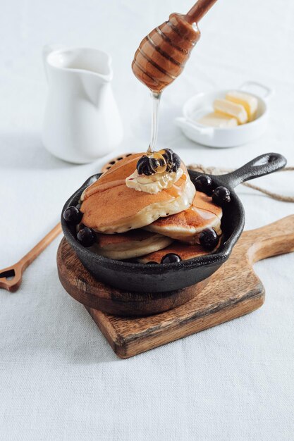 Pancakes with honey and berries