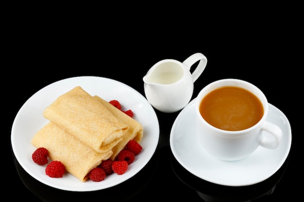 Pancakes with raspberries in coffee and milk Sweet breakfast