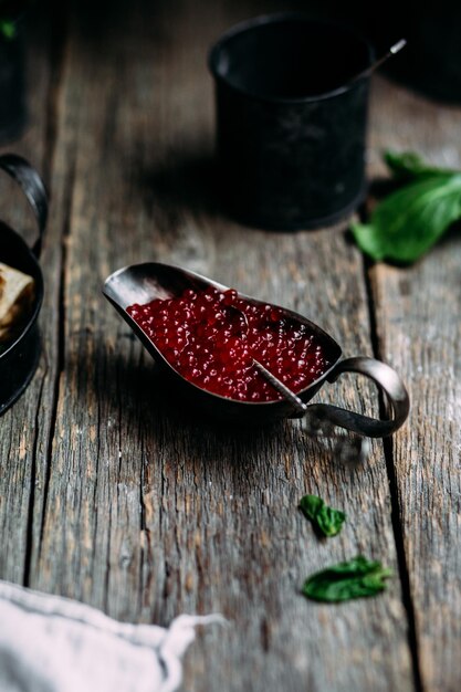 Pancakes with red caviar and salmon in a plate. Maslenitsa holiday