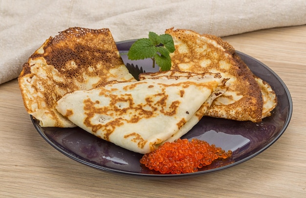 Pancakes with red caviar