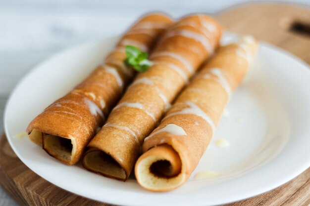 Pancakes with sauce. Condensed milk and pancakes.