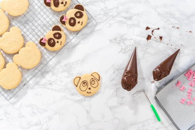 Panda shaped shortbread cookies with chocolate icing