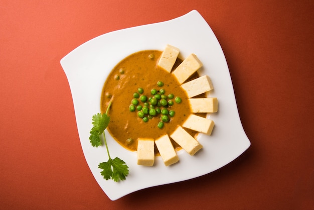 Paneer butter masala is famous indian food recipe made using cottage cheese, served in a bowl. selective focus