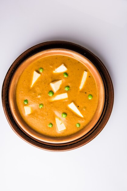 Paneer Butter Masala is famous indian food recipe made using cottage cheese, served in a bowl. selective focus