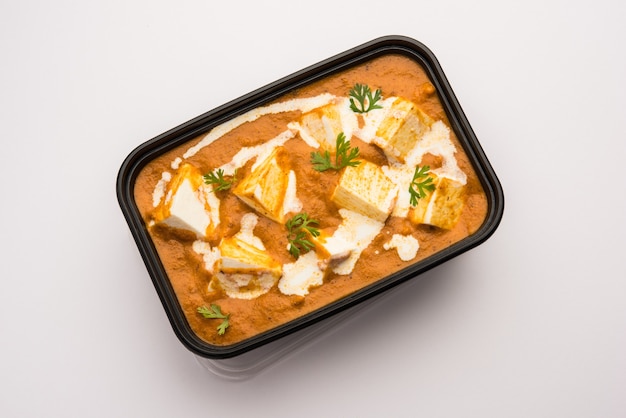 Paneer Butter Masala packed in plastic container or box, ready for home delivery or pickup