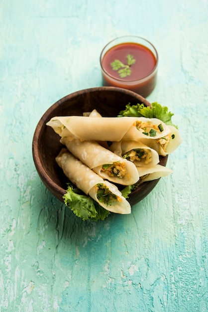 Paneer chilli cigar are crispy rolls stuffed with paneer which is an interesting starter for any party. served with tomato ketchup. selective focus