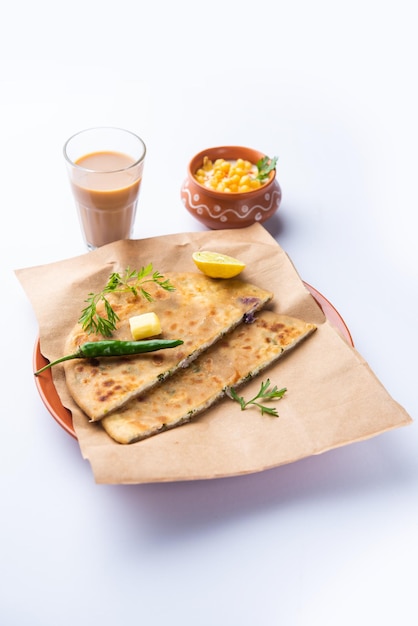 Paneer paratha is a popular North Indian flatbread made with whole wheat flour dough and stuffed with savory, spiced, grated paneer