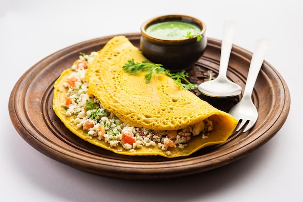 Paneer stuffed Besan chilla or Cheela made using chickpea flour with cottage cheese stuffing