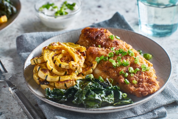 Panfried catfish with squash and spinach