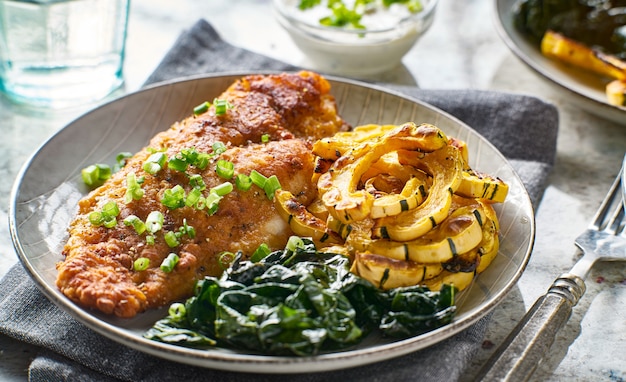 Panfried catfish with squash and spinach