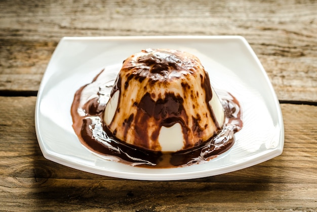 Panna cotta under chocolate sauce