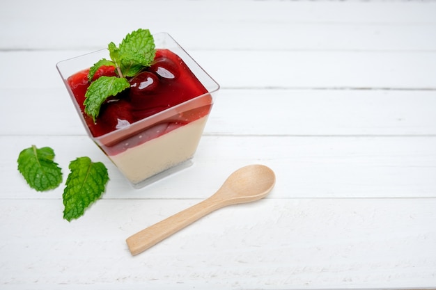 Panna Cotta Strawberry in a glass Placed on a white table