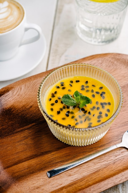 Panna cotta with mango and passion fruit sauce